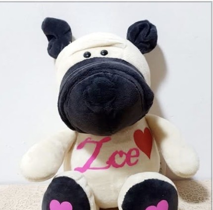 Cream cow plush with the name Ice and a pink heart
